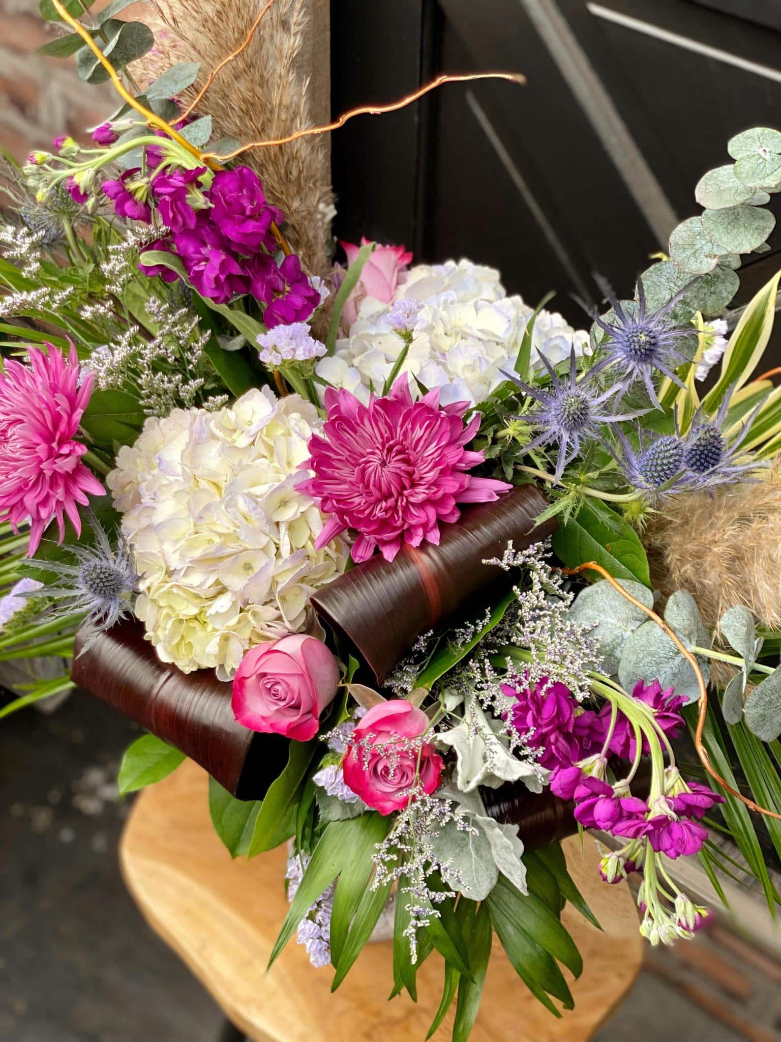 The Watering Can | Close up of the flowers in a large purple bouquet.