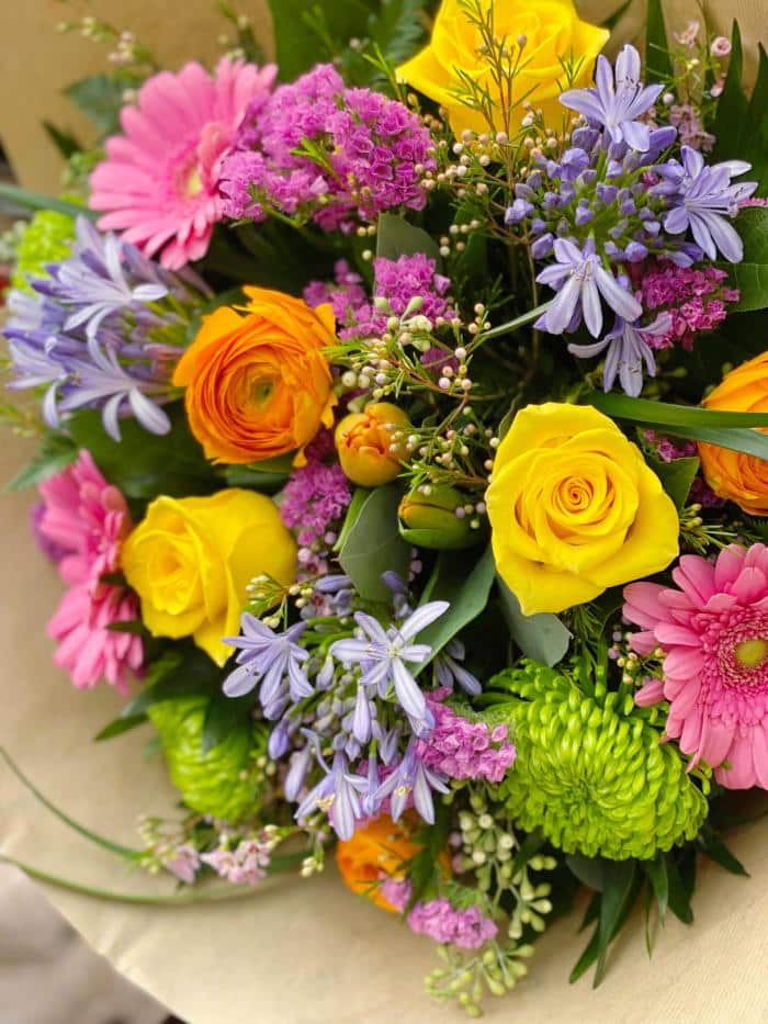 The Watering Can | Close up of a rainbow coloured bouquet.