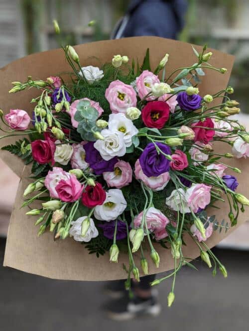 The Watering Can | A large hand-tied bouquet of assorted lisianthus.