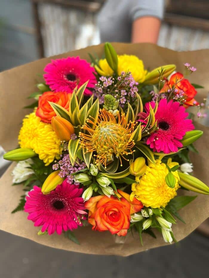 The Watering Can | A bright, joyful, and summery hand-tied bouquet.