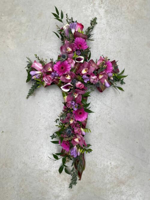 The Watering Can | A hot pink and purple floral cross.