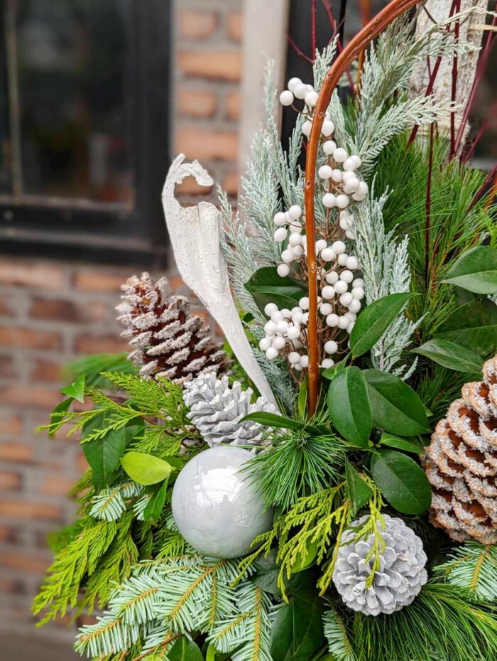 The Watering Can | A close up of the decorations in a white winter urn.