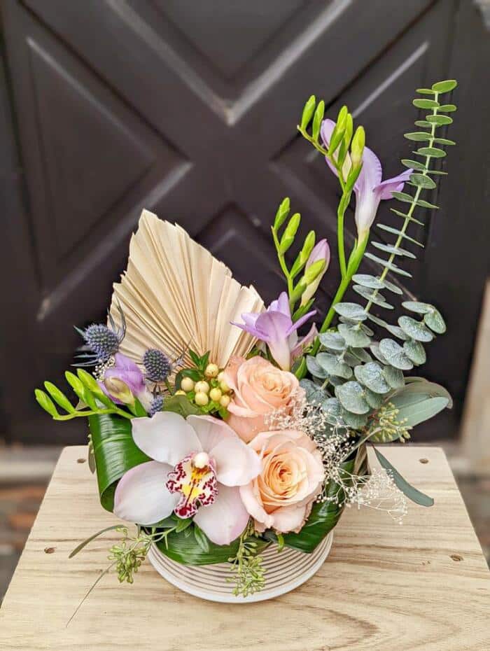 The Watering Can | A pastel coloured European style arrangement with fresh and dried flowers.