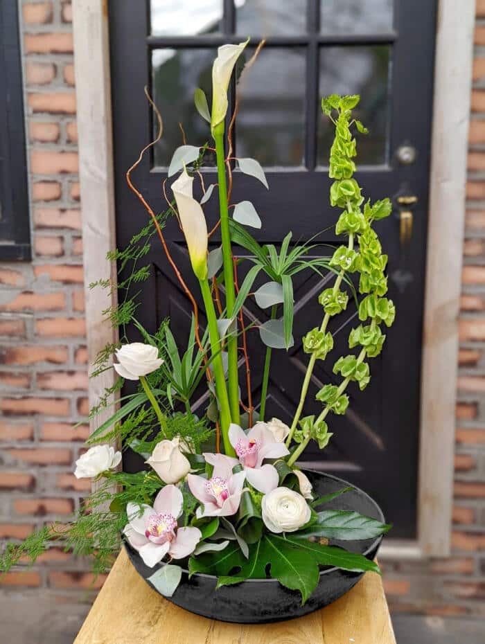 The Watering Can | An airy and tall European arrangement in whites, blush and green designed in a large shallow bowl.