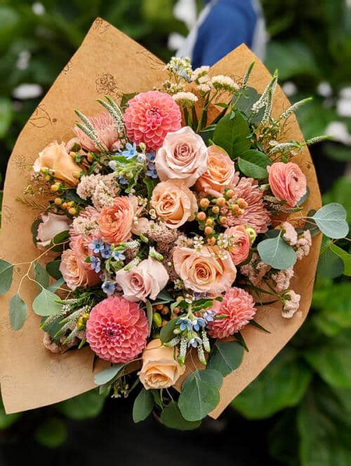 The Watering Can | A lush peach hand-tied bouquet.
