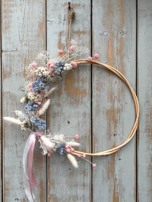 The Watering Can | This kit is designed on a rattan wreath with an assortment of dried florals in soft pinks, blues and creams.