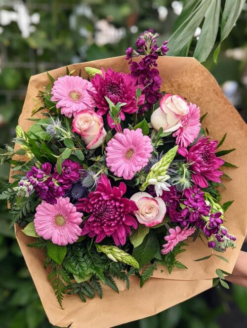 a wine coloured palette bouquet. featuring fragrant dark pink stock, dark purple mums, pink gerberas and much more.