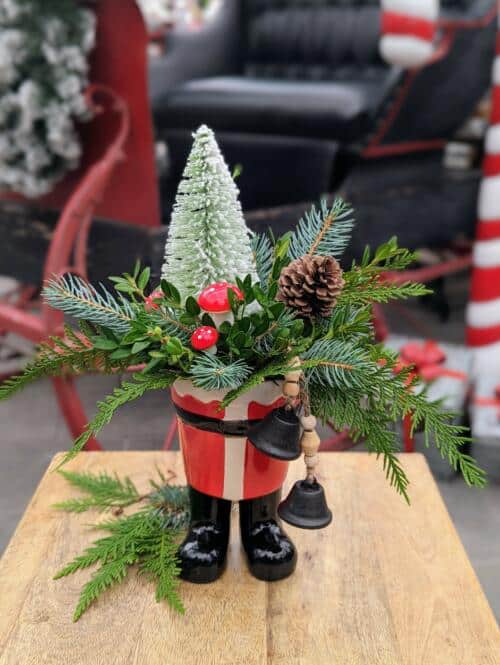 The Watering Can | This kit features a ceramic pot shaped like santas boots, seasonal evergreens and decorations.