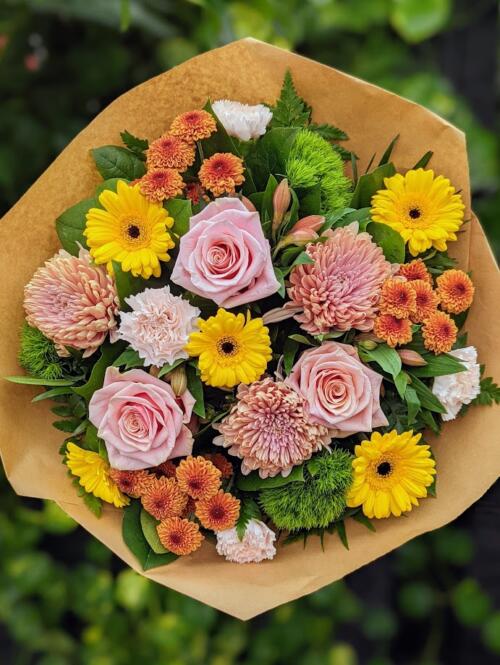 yellow mini gerberas, blush mums, bronze spray mums, peach alstromeria and more