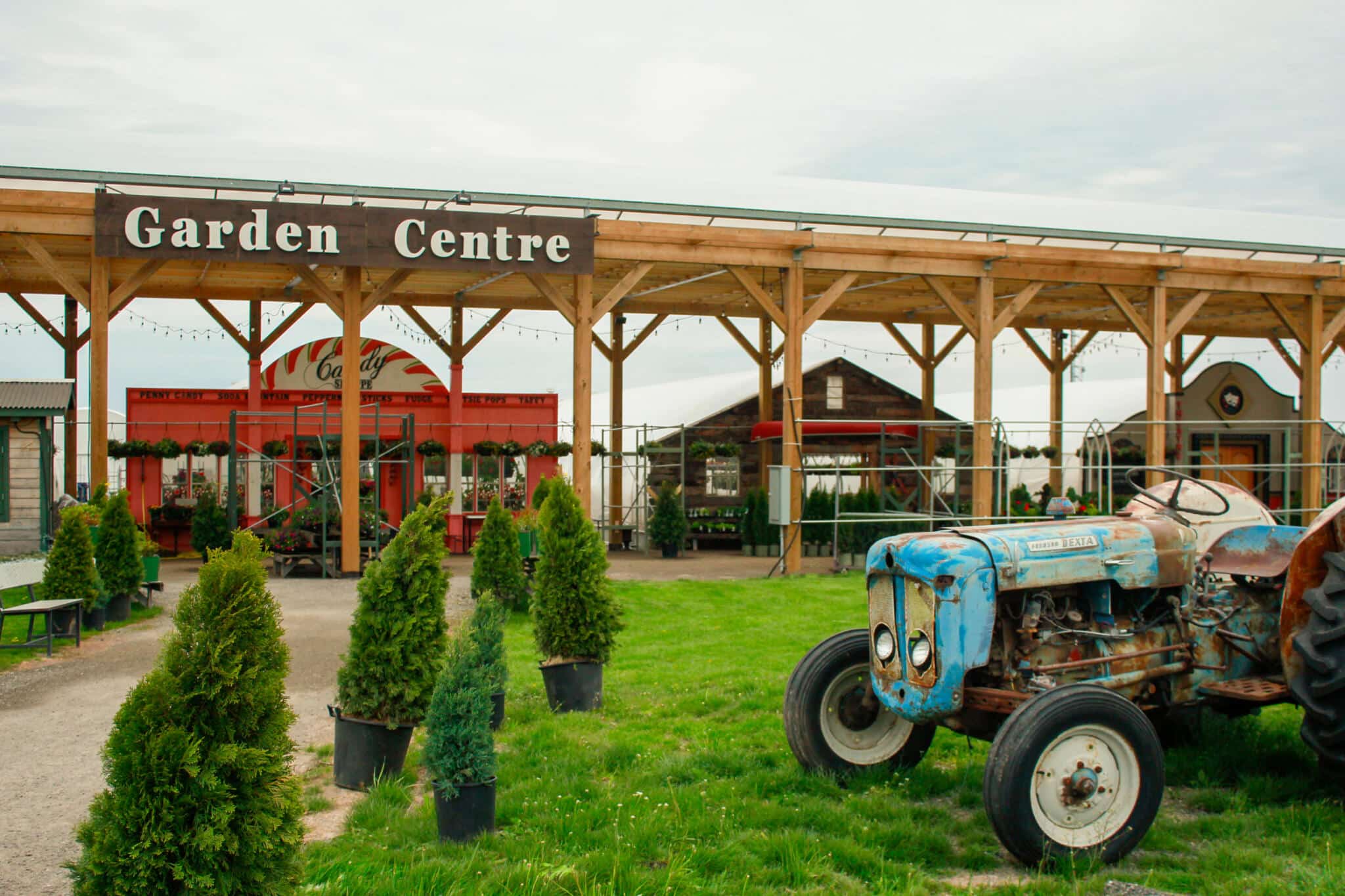 The Watering Can Garden Centre Exterior view of The Watering Can Garden Centre in Vineland with the iconic blue tractor on display.